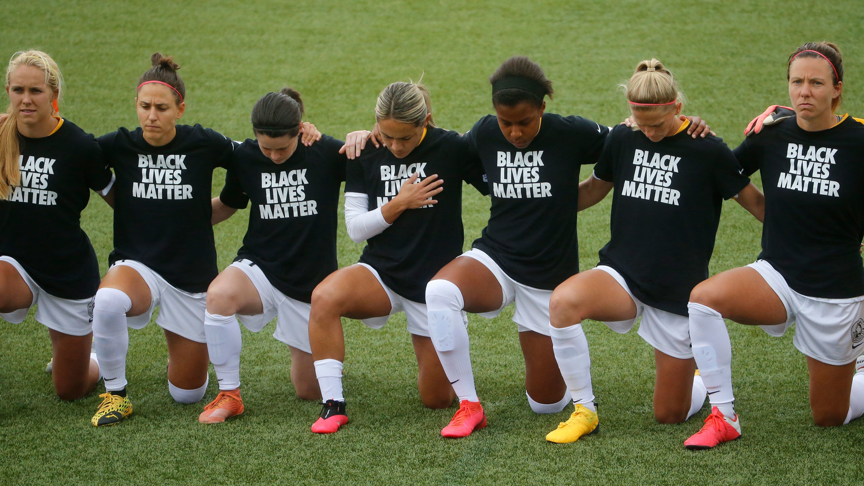 Women's soccer league players and officials kneel during anthem | CNN