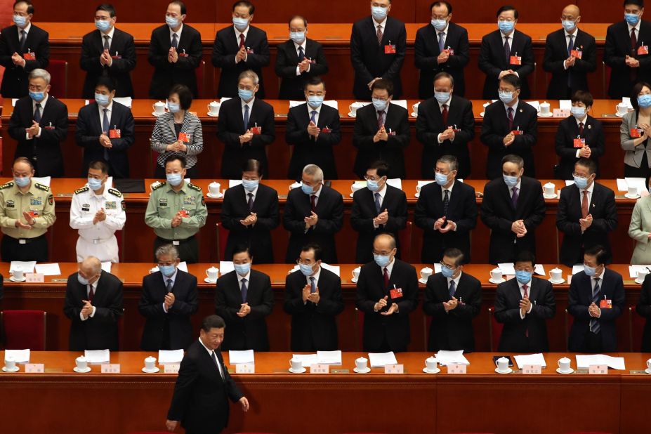 Delegates applaud as Chinese President Xi Jinping arrives for the opening session of China's National People's Congress on May 22.