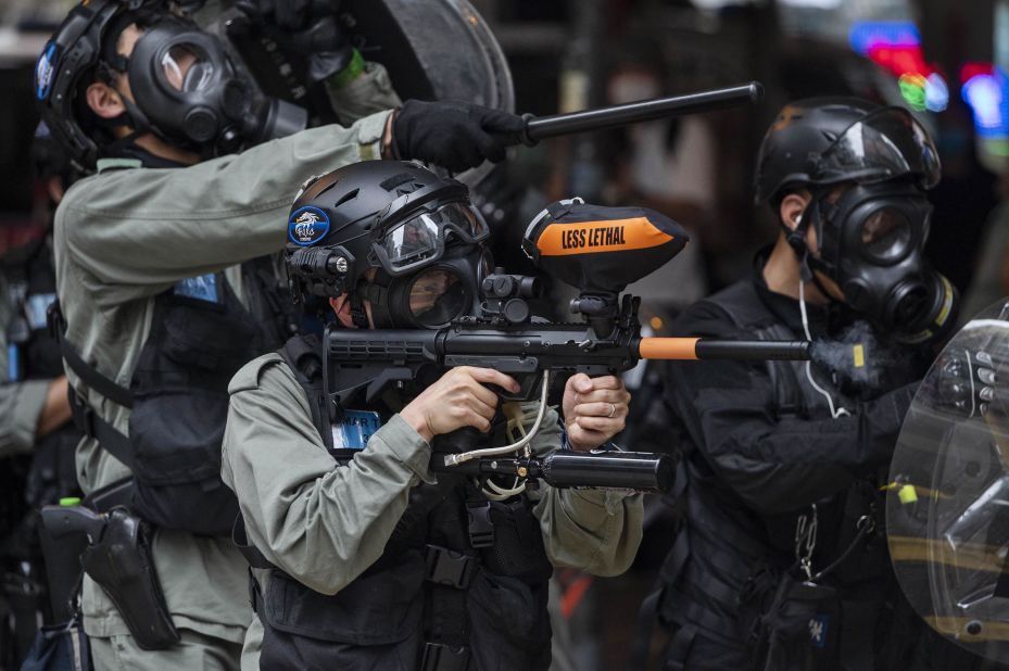 A police officer fires on protesters in Causeway Bay on May 24.