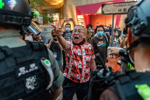 A pro-democracy protester shouts at police during a rally on June 12.