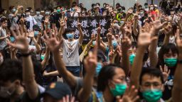 Protesters chant slogans during a rally against a new national security law in Hong Kong on July 1, 2020, on the 23rd anniversary of the city's handover from Britain to China. - Hong Kong police made the first arrests under Beijing's new national security law on July 1 as the city greeted the anniversary of its handover to China with protesters fleeing water cannon. (Photo by DALE DE LA REY / AFP) (Photo by DALE DE LA REY/AFP via Getty Images)