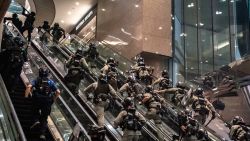 HONG KONG, CHINA - JULY 01: Riot police officers charge up escalators and shoot pepperball projectiles at a shopping mall during a anti-national security law demonstration on July 1, 2020 in Hong Kong, China. Hong Kong marks the 23rd anniversary of its handover to China on July 1 after Beijing imposed the new national security law. (Photo by Anthony Kwan/Getty Images)