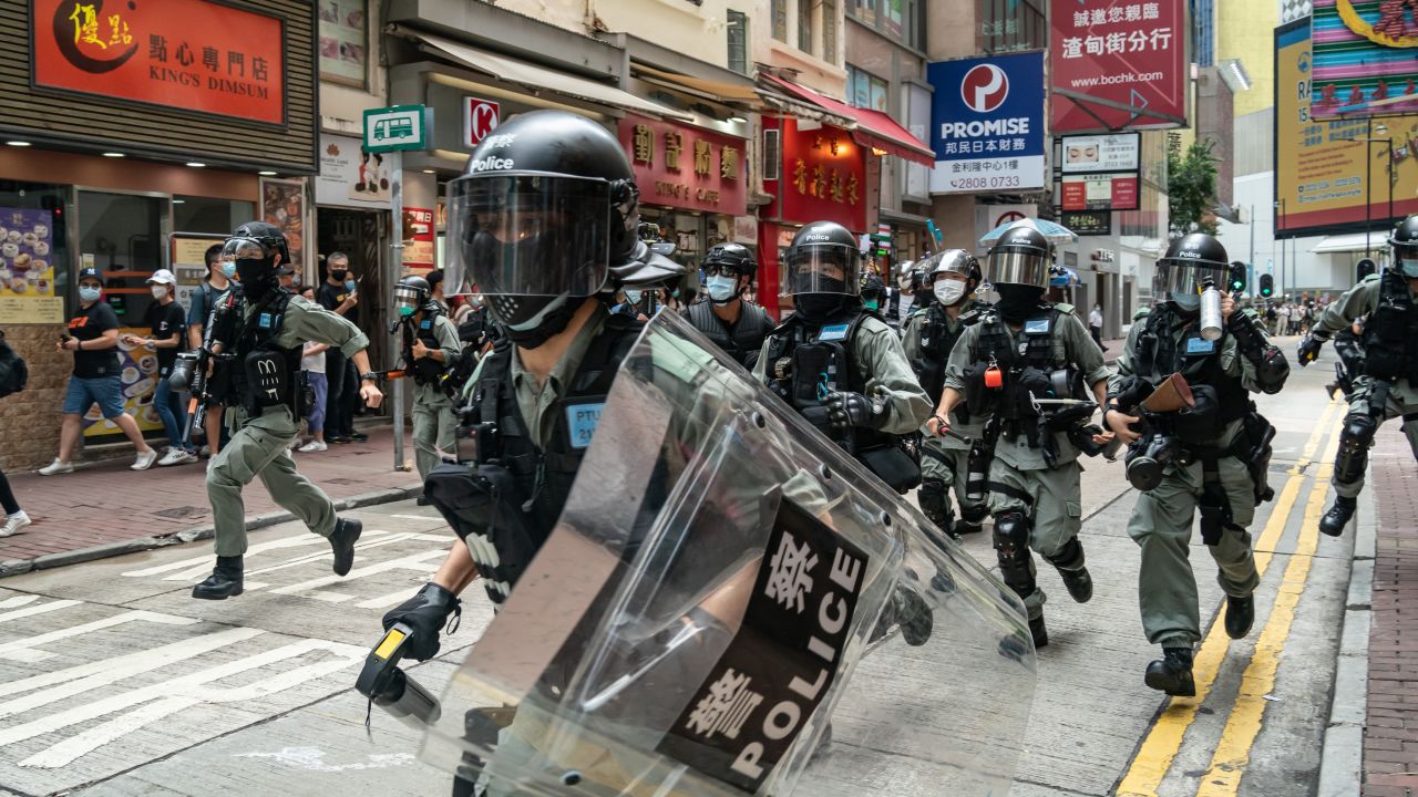 Riot police toward pedestrians during a demonstration on July 1, 2020 in Hong Kong.