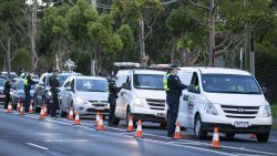 Police check drivers at a roadblock in suburban Melbourne, Australia, Thursday, July 2, 2020. Thousands of residents in dozens of suburbs of Melbourne, are preparing to lockdown for a month with the Victoria state premier warning a state-wide shutdown is possible if coronavirus cases continue to rise. (Daniel Pockett/AAP Image via AP)