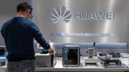 An employee works in the customer service center inside the Huawei Technologies Co. store in Brussels, Belgium, on Tuesday, Feb. 4, 2020. Huawei is in talks about investing in European tech startups and contributing to research in a bid to secure its supply chain as tensions with the U.S. escalate, people familiar with the matter said. Photographer: Geert Vanden Wijngaert/Bloomberg/Getty Images