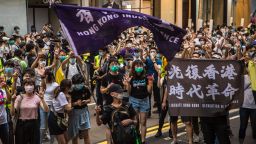 Protesters chant slogans during a rally against a new national security law in Hong Kong on July 1, 2020, on the 23rd anniversary of the city's handover from Britain to China. - Hong Kong police made the first arrests under Beijing's new national security law on July 1 as the city greeted the anniversary of its handover to China with protesters fleeing water cannon. (Photo by DALE DE LA REY / AFP) (Photo by DALE DE LA REY/AFP via Getty Images)