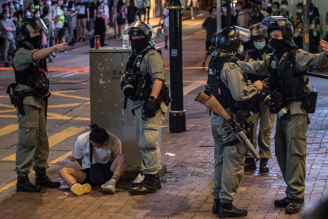 Riot police detain a man after they cleared protesters taking part in a rally against a new national security law in Hong Kong on July 1, 2020.