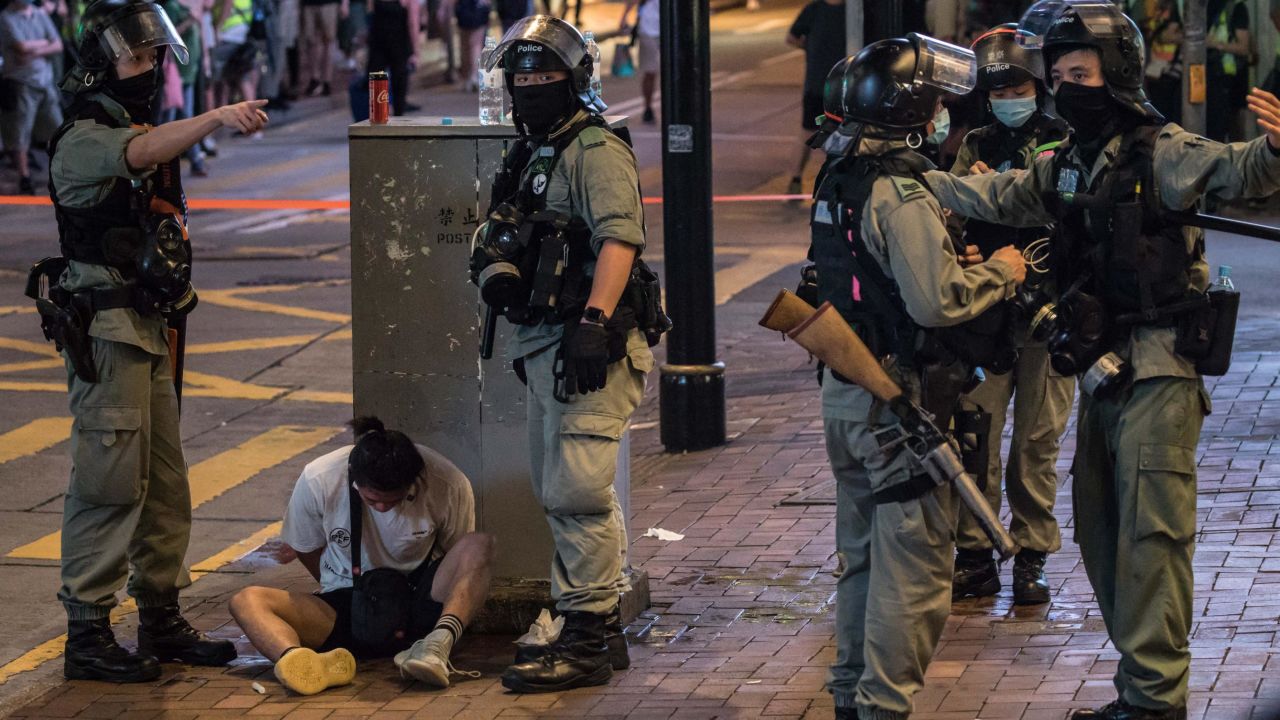 Riot police detain a man after they cleared protesters taking part in a rally against a new national security law in Hong Kong on July 1, 2020.