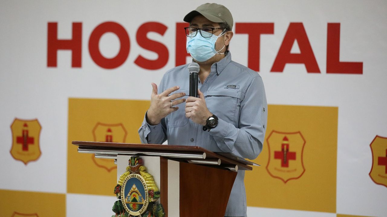 Honduras' President Juan Orlando Hernandez speaks after his discharge from the Military Hospital in Tegucigalpa on Thursday.