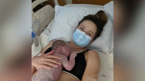 Jessica Johnson holds her baby daughter shortly after giving birth in May.