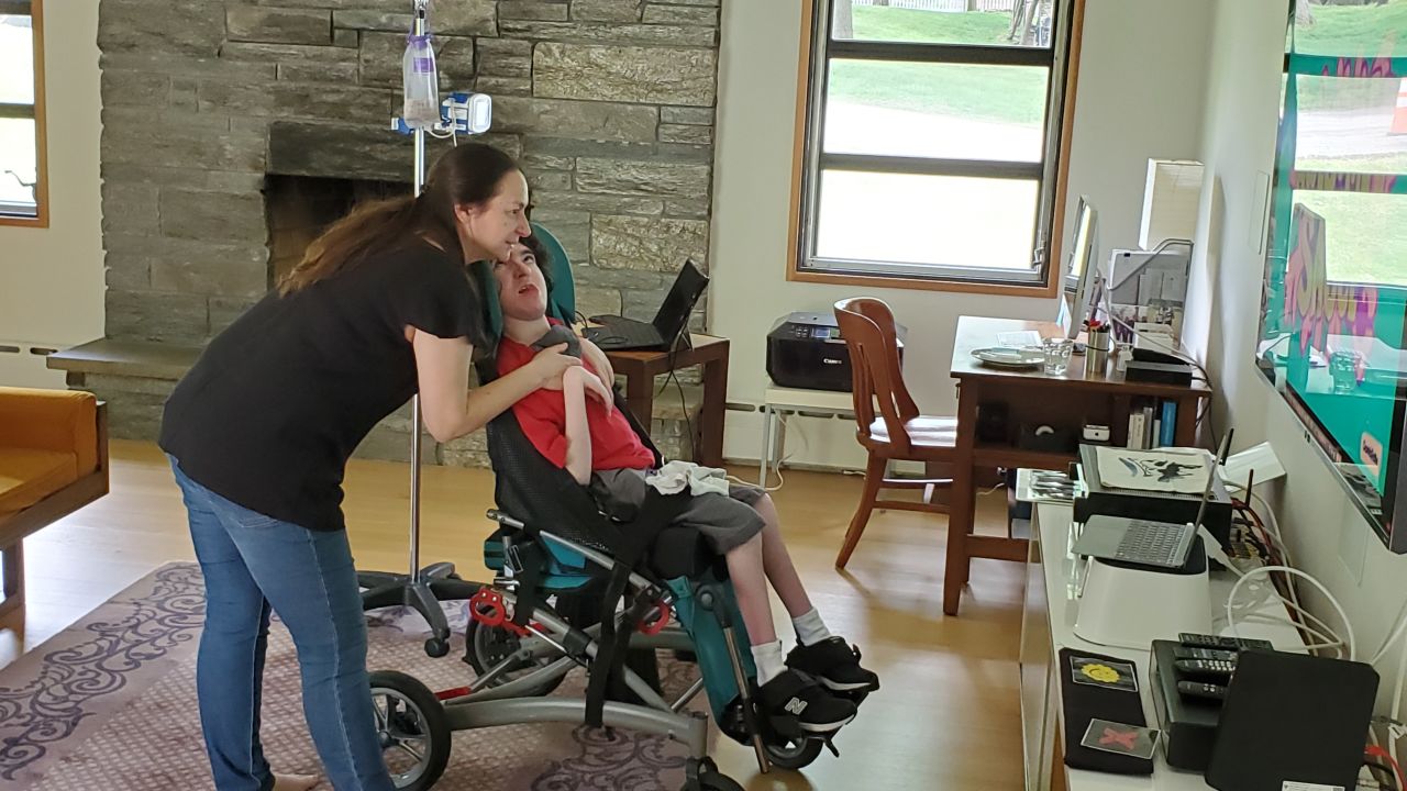 Ben, here with mom Joanne De Simone, has a  condition that makes coronavirus more dangerous to him, so he cannot get his usual in-person therapy and services. 