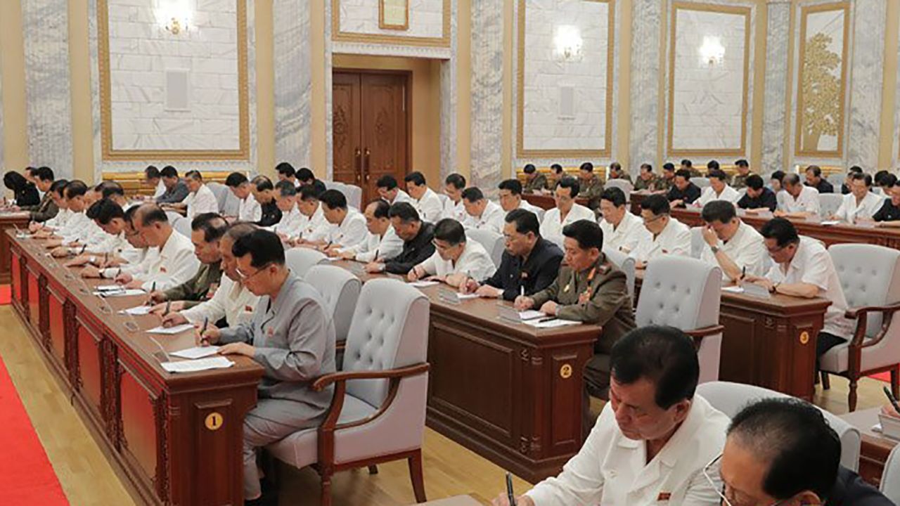 North Korean leader Kim Jong Un is seen at the Thursday meeting in this photograph provided by KCNA. Officials do not appear to be wearing masks or practicing social distancing.