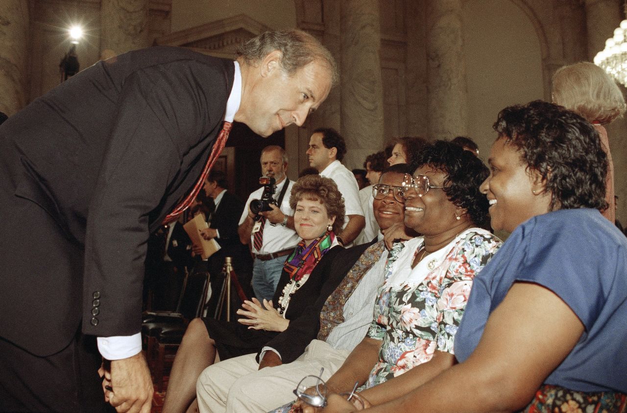 US Sen. Joe Biden, chairman of the Senate Judiciary Committee, meets with members of Thomas' family prior to the start of a hearing in September 1991. From left is Thomas' wife, Virginia; his son, Jamal; his mother, Leola; and his sister Emma Mae.