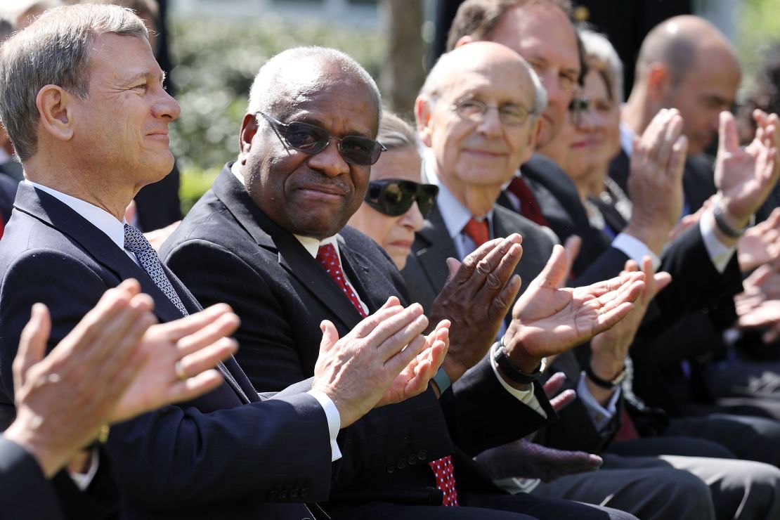In this April 10, 2017, file photo, Supreme Court Chief Justice John Roberts and associate Justices Clarence Thomas, Ruth Bader Ginsburg, Stephen Breyer and Samuel Alito attend the ceremony where Judge Neil Gorsuch takes the judicial oath during a ceremony in the Rose Garden at the White House.