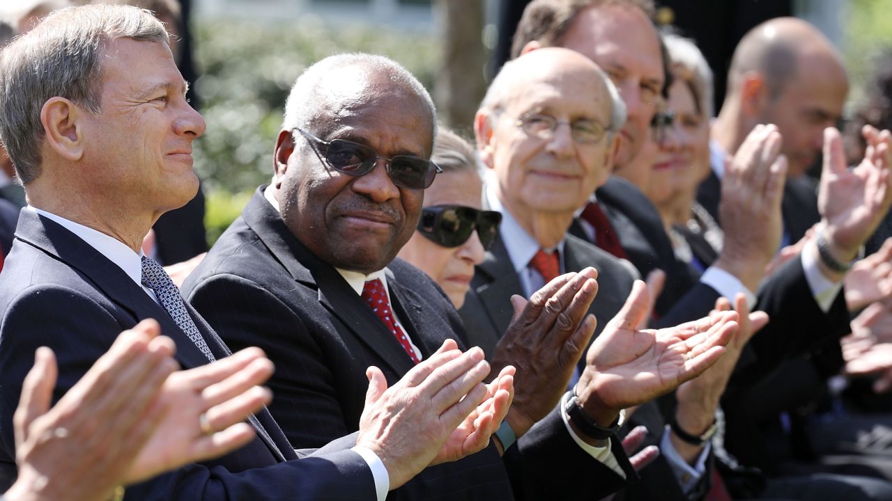 In this April 10, 2017, file photo, Supreme Court Chief Justice John Roberts and associate Justices Clarence Thomas, Ruth Bader Ginsburg, Stephen Breyer and Samuel Alito attend the ceremony where Judge Neil Gorsuch takes the judicial oath during a ceremony in the Rose Garden at the White House.