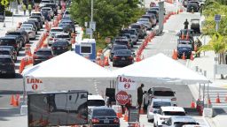 Cars wait in line at the COVID-19 drive-up testing site at the Miami Beach Convention Center on July 2, 2020 in Miami Beach, Florida.