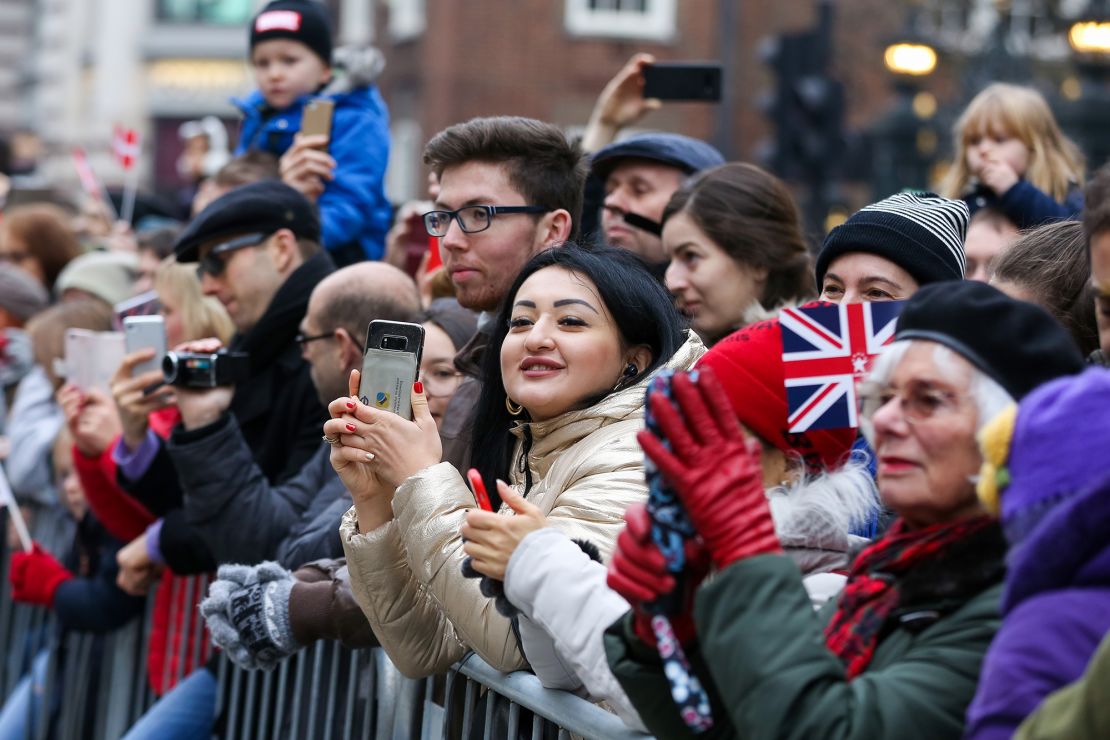Spectators at the New Year's Day Parade. Over 10,000 performers paraded from Piccadilly Circus to Parliament Square.