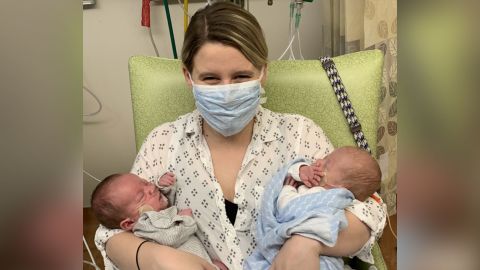 Chelsea McGinnis cradles her sons in the NICU.