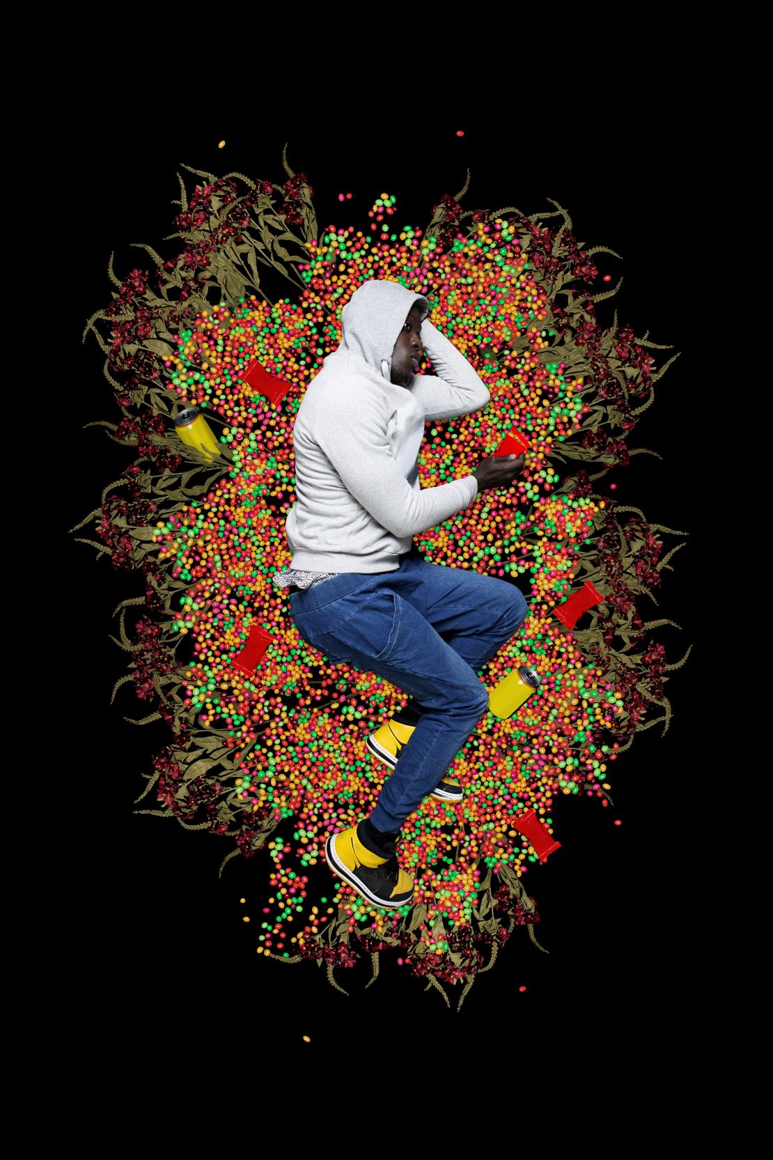 Diop represents each story of Black resistance through allegorical portraits. In this image, he plays the role of young Trayvon Martin, who was wearing a hoodie and had just bought a pack of Skittles when he was killed.