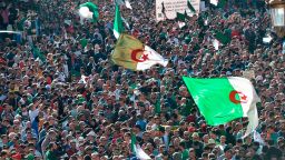 Algerians take part in an anti-government demonstration in the capital Algiers on November 1, 2019. - Demonstrators converged on Algiers in their thousands for a massive anti-government rally called to coincide with official celebrations of the anniversary of the war that won Algeria's independence from France. (Photo by RYAD KRAMDI / AFP) (Photo by RYAD KRAMDI/AFP via Getty Images)