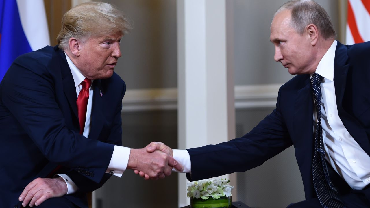 Russian President Vladimir Putin (R) and US President Donald Trump shake hands before a meeting in Helsinki, on July 16, 2018. (Photo by Brendan Smialowski / AFP)        (Photo credit should read BRENDAN SMIALOWSKI/AFP via Getty Images)