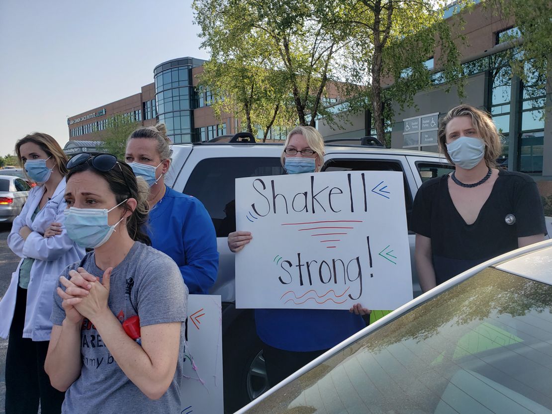 Healthcare workers celebrate Shakell Avery's recovery outside Menorah Medical Center on June 30.