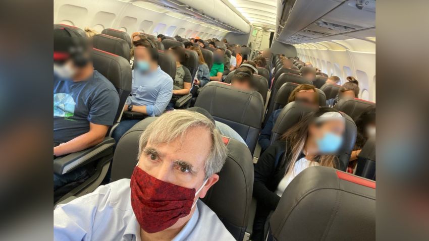 CAPTION SHOULD INDICATE IMAGE WAS RECEIVED BLURRED. Senator Jeff Merkley: "@AmericanAir: how many Americans will die bc you fill middle seats, w/ your customers shoulder to shoulder, hour after hour. This is incredibly irresponsible. People eat & drink on planes & must take off masks to do so. No way you aren't facilitating spread of COVID infections."