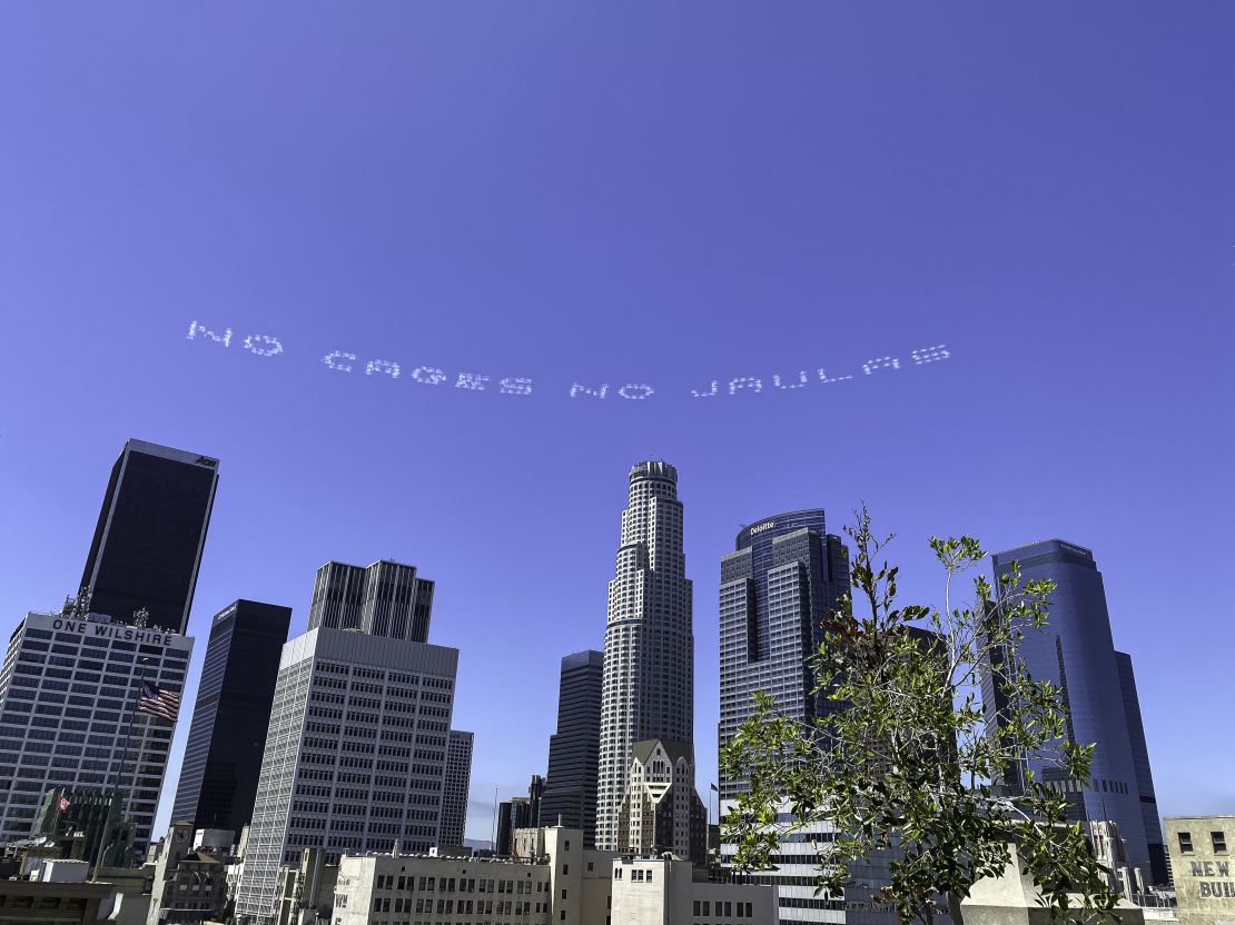 Artist Beatriz Cortez's message "No Cages No Jualas" over a Los Angeles immigration court on July 3.