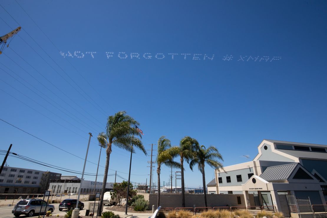 Artist Tina Takemoto's message "Not Forgotten" over federal prison Terminal Island in San Diego on July 3.
