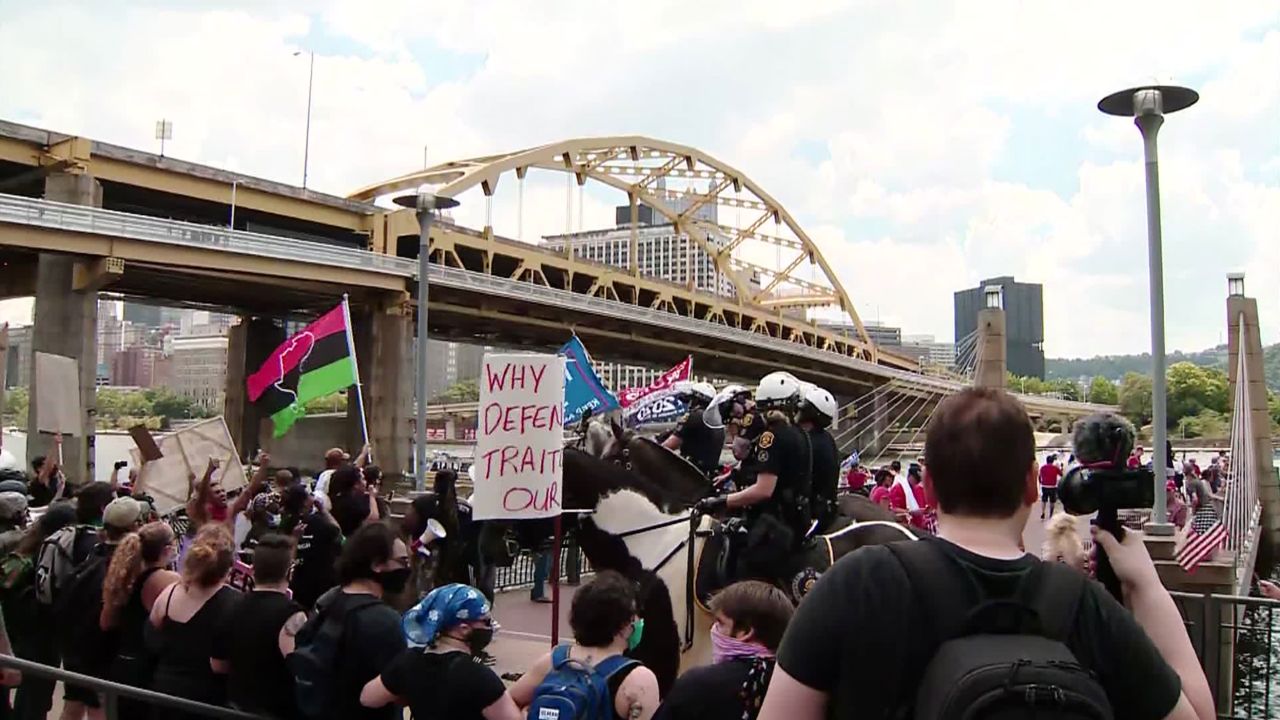 Counterprotesters in Pittsburgh rallied near a boat parade held in support of President Donald Trump.