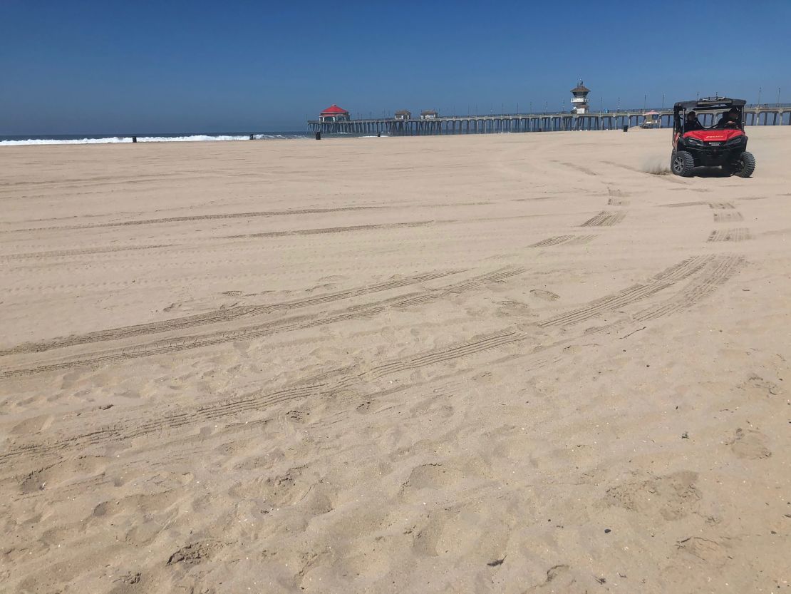 A normally crowded beach in Huntington Beach, California, is empty on July 4, 2020.