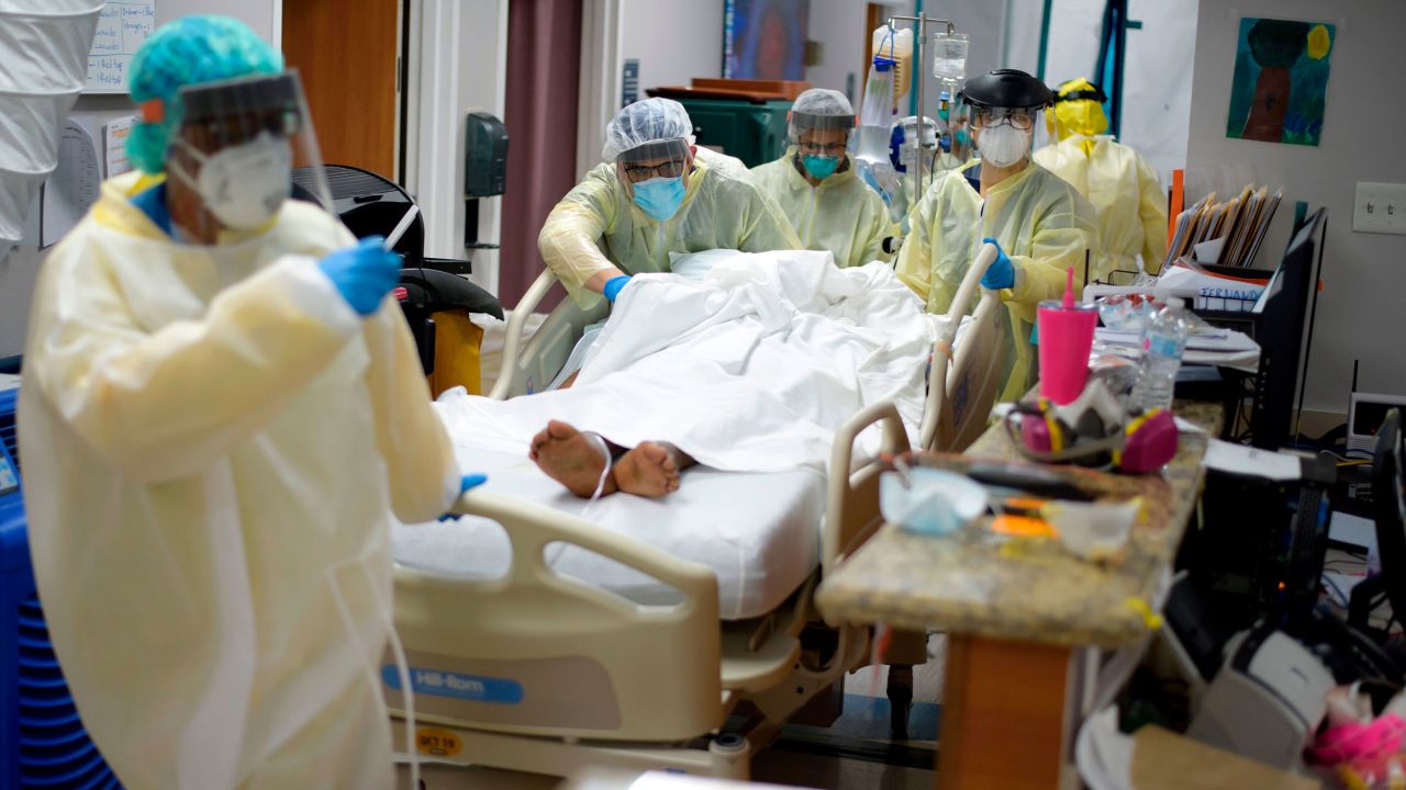 Healthcare workers move a patient in the Covid-19 Unit at United Memorial Medical Center in Houston, Texas Thursday, July 2, 2020. - Despite its renowned medical center with the largest agglomeration of hospitals and research laboratories in the world, Houston is on the verge of being overwhelmed by cases of coronavirus exploding in Texas. (Photo by Mark Felix / AFP) / RESTRICTED TO EDITORIAL USE
TO GO WITH AFP STORY by Julia Benarrous: "Covid-19: Houston's hospital system underwater" (Photo by MARK FELIX/AFP via Getty Images)