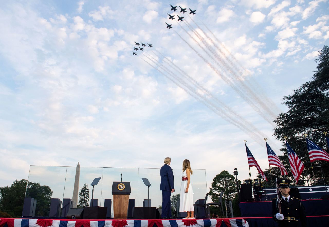 President Donald Trump and First Lady Melania Trump watch as the US Navy Blue Angels and US Air Force Thunderbirds fly over the National Mall in Washington, DC.