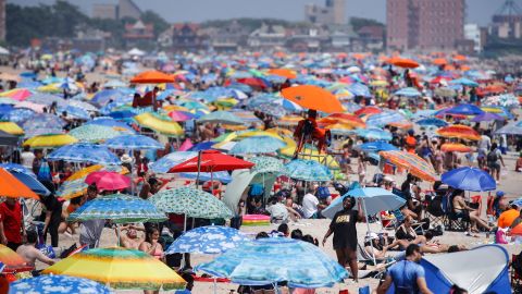 Revelers enjoy the beach at Coney Island, Saturday, July 4, 2020, in the Brooklyn borough of New York. 