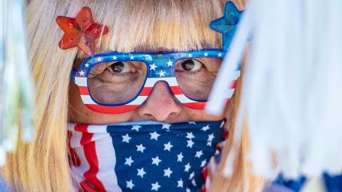 Christine Smith waits for the start of the Independence Day golf cart parade through Laguna Woods Village in Laguna Woods, California.