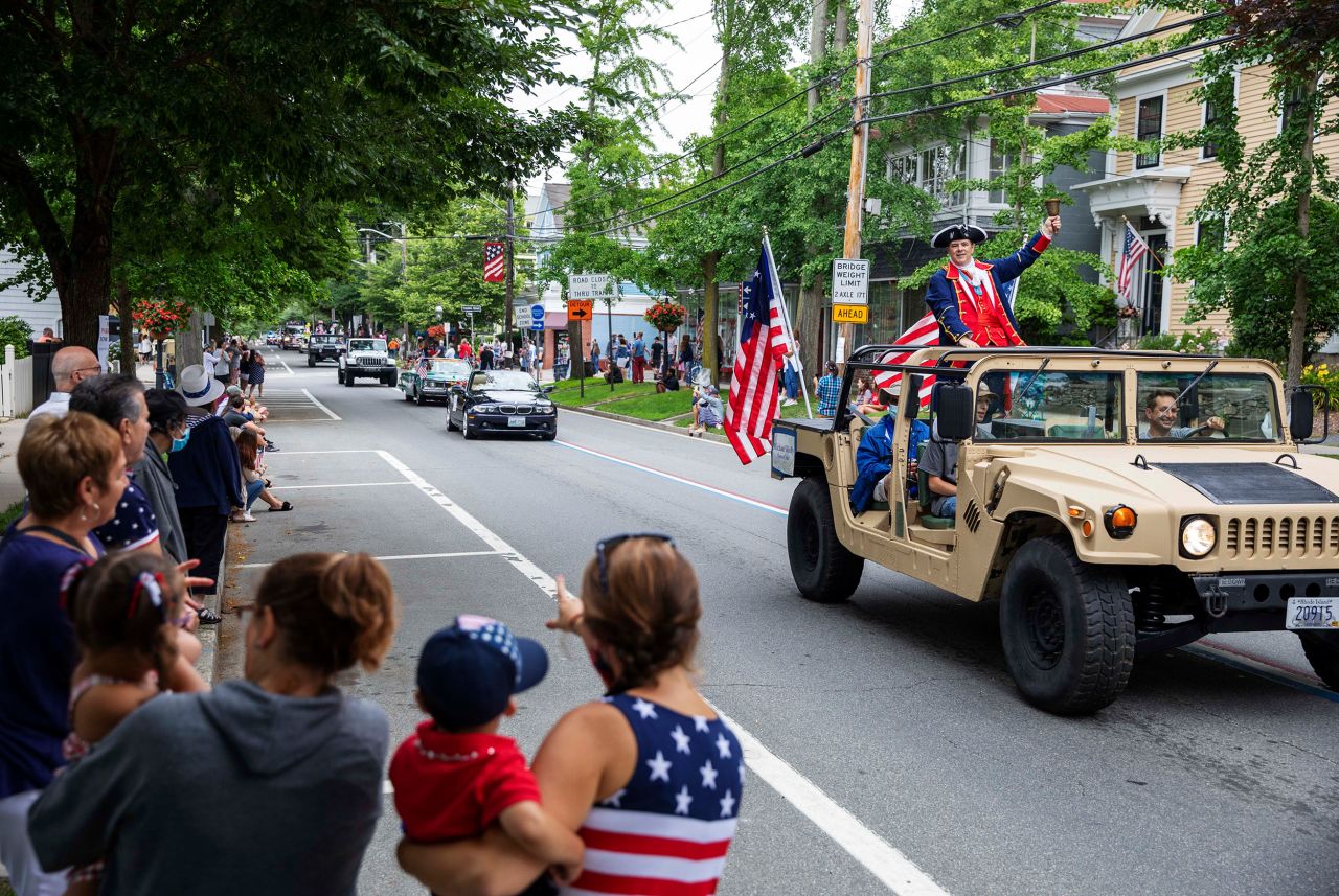 Spectators watch a Fourth of July parade in Bristol, Rhode Island.