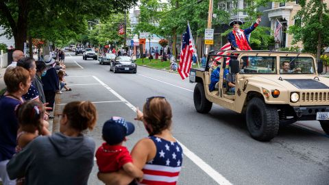 Spectators watch a Fourth of July parade in Bristol, Rhode Island.