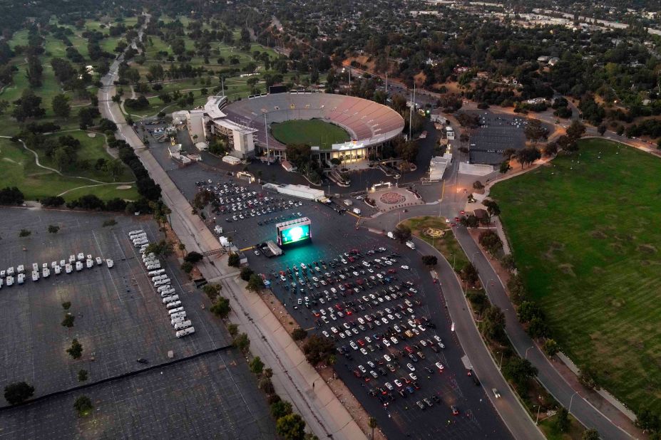 People watch a movie at the Tribeca Drive-In at the Rose Bowl Stadium in Pasadena, California.