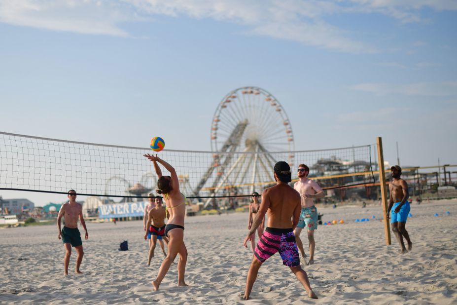 Friends play beach volleyball in Wildwood, New Jersey.