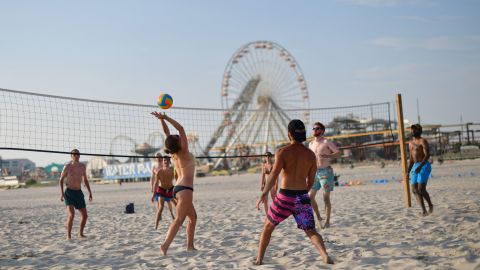 Friends play beach volleyball in Wildwood, New Jersey.
