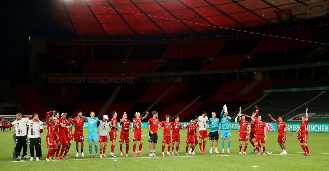 Bayern players celebrate winning the German Cup in a totally empty Olympiastadion.