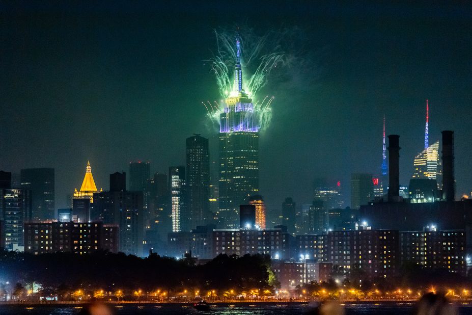 Fireworks burst from the top of the Empire State Building during the Macy's Fourth of July Fireworks Spectacular in New York City. 