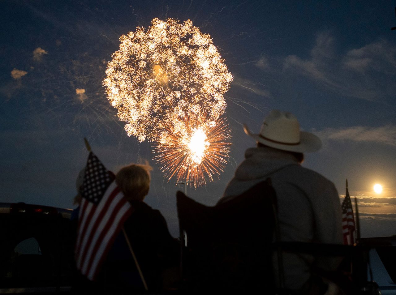 A family watches the fireworks display at The Ranch Event Complex in Loveland, Colorado.