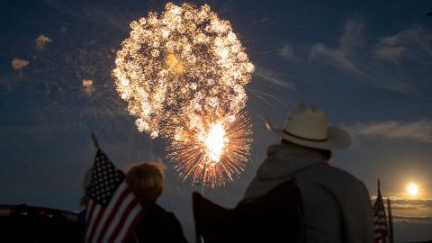 A family watches the fireworks display at The Ranch Event Complex in Loveland, Colorado.