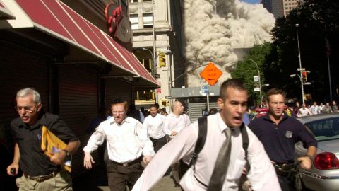 Stephen Cooper is pictured far left, wearing a black shirt, in this 9/11 photo.