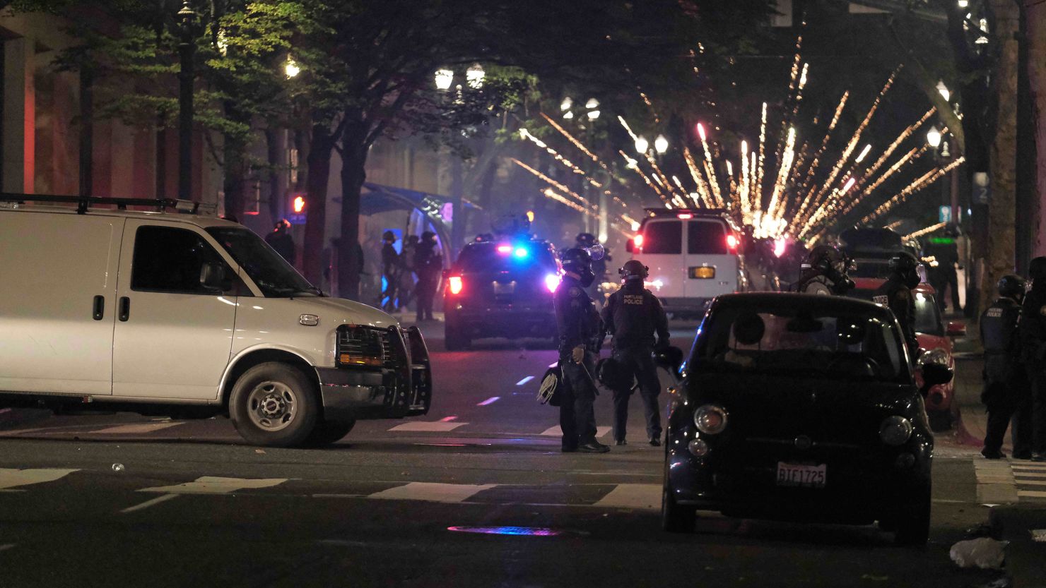 Police clear the streets near the Justice Center after a riot was declared in Portland, Oregon, on Saturday, July 4.