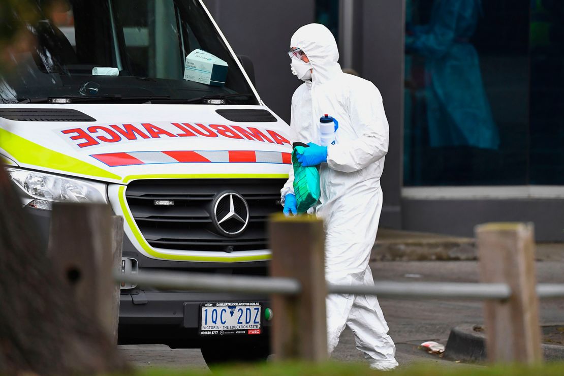 An ambulance is seen outside one of nine public housing estates locked down due to a spike in COVID-19 coronavirus numbers in Melbourne on July 6.