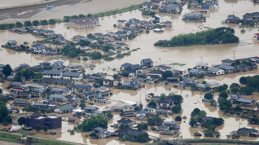 This picture shows inundated houses due to heavy rain in Hitoyoshi, Kumamoto prefecture on July 4, 2020. - Fourteen people were feared dead at a nursing home in western Japan on July 4 as record rainfall triggered massive floods and landslides, forcing authorities to issue evacuation advisories for more than 200,000 residents. (Photo by STR / JIJI PRESS / AFP) / Japan OUT (Photo by STR/JIJI PRESS/AFP via Getty Images)