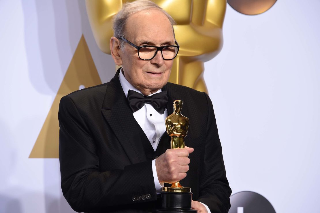 Composer Ennio Morricone poses with the Oscar for Best Original Score, for "The Hateful Eight." 