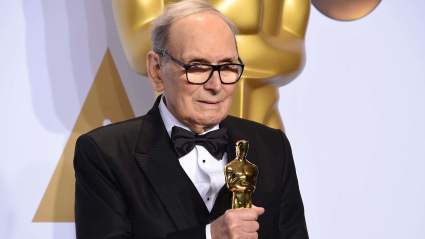 Composer Ennio Morricone poses with the Oscar for Best Original Score, "The Hateful Eight," in the press room during the 88th Oscars in Hollywood on February 28, 2016. (Photo by Robyn BECK / AFP) (Photo by ROBYN BECK/AFP via Getty Images)